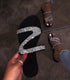 Jeweled sandal.